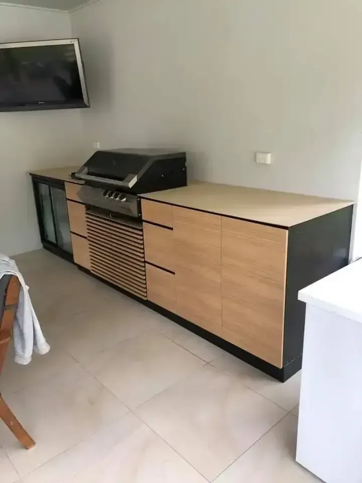 A Kitchen With A Grill And A Television On The Wall — O'Donnell Cabinetmaking in Kawana, QLD