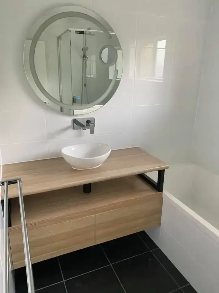 A Bathroom With A Sink , Mirror And Bathtub — O'Donnell Cabinetmaking in Kawana, QLD