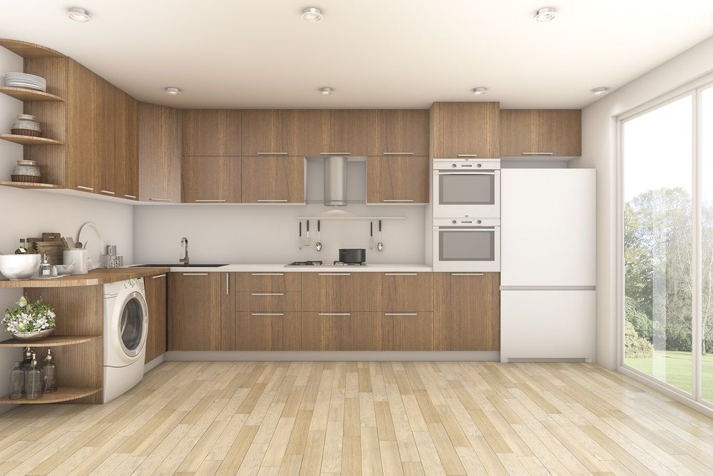 A Kitchen With Wooden Cabinets , A Washer And Dryer , And A Refrigerator — O'Donnell Cabinetmaking in Emu Park, QLD