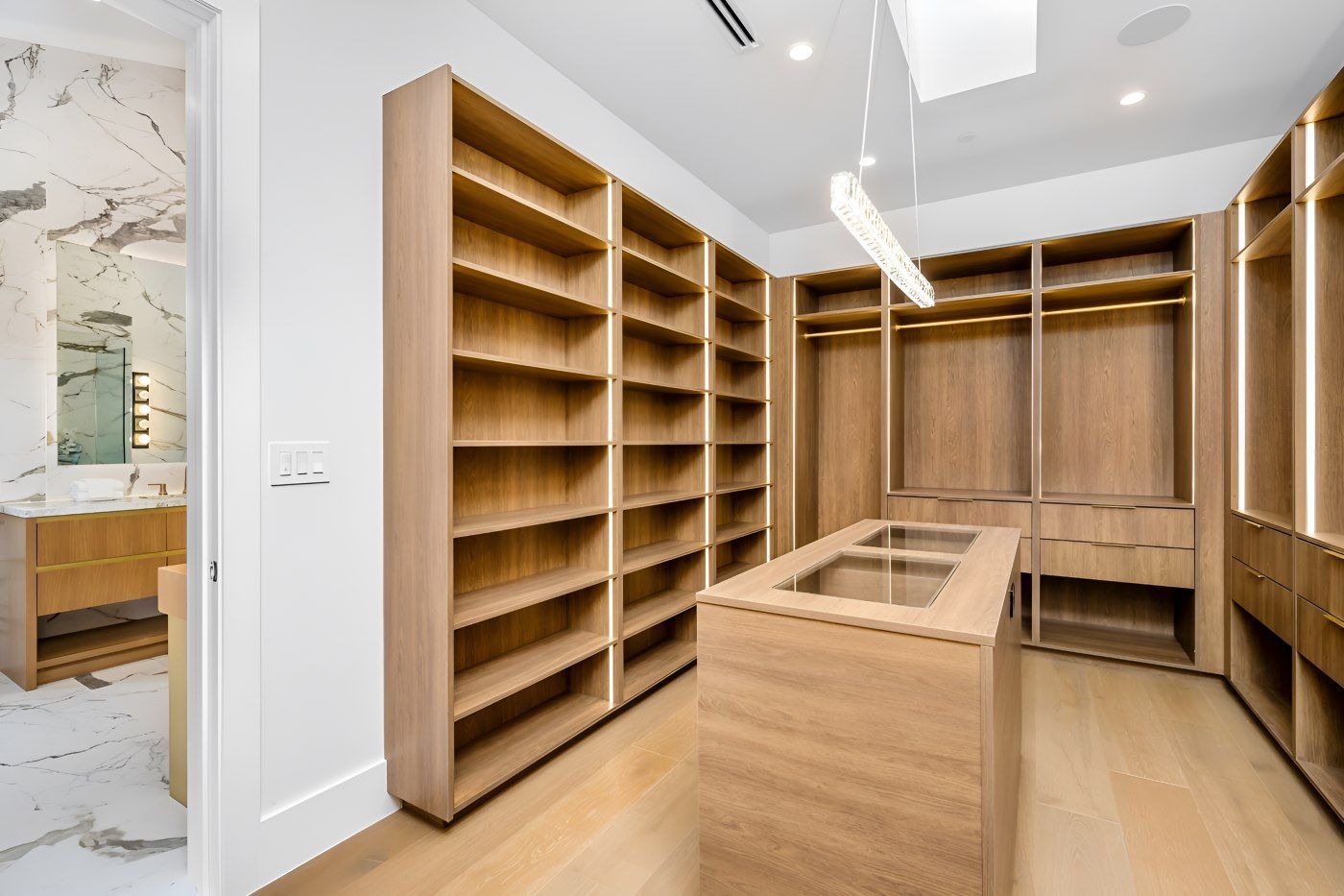 A Walk In Closet With Lots Of Wooden Shelves And Drawers — O'Donnell Cabinetmaking in Emu Park, QLD