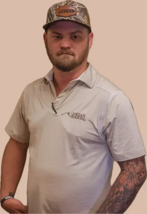 A man wearing a white shirt and a camo hat
