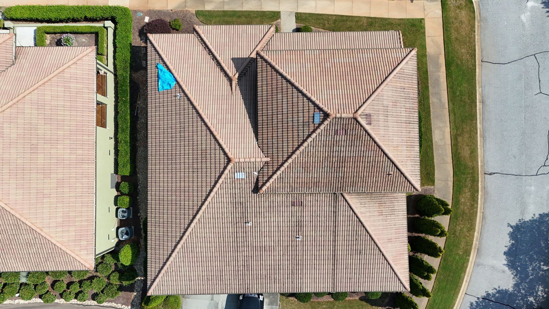 An aerial view of a house with a tiled roof.