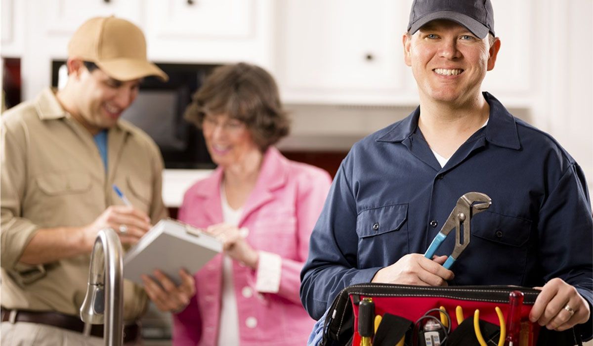 plumber smiling with a house owner