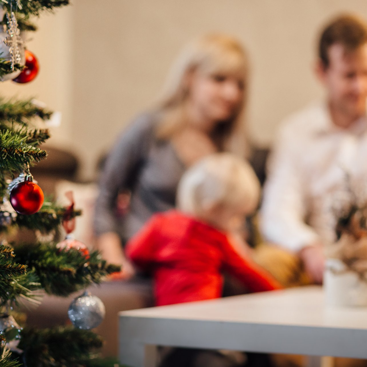 Family by their Christmas tree.