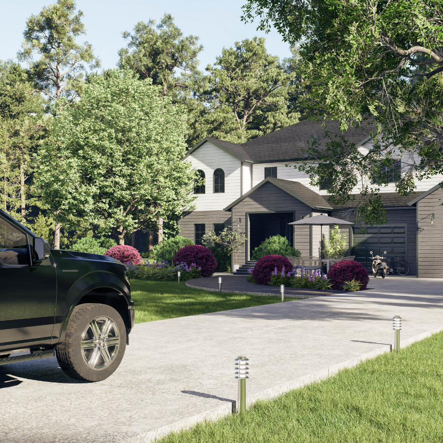 Suburban house with driveway, black truck, and manicured lawn with purple shrubs
