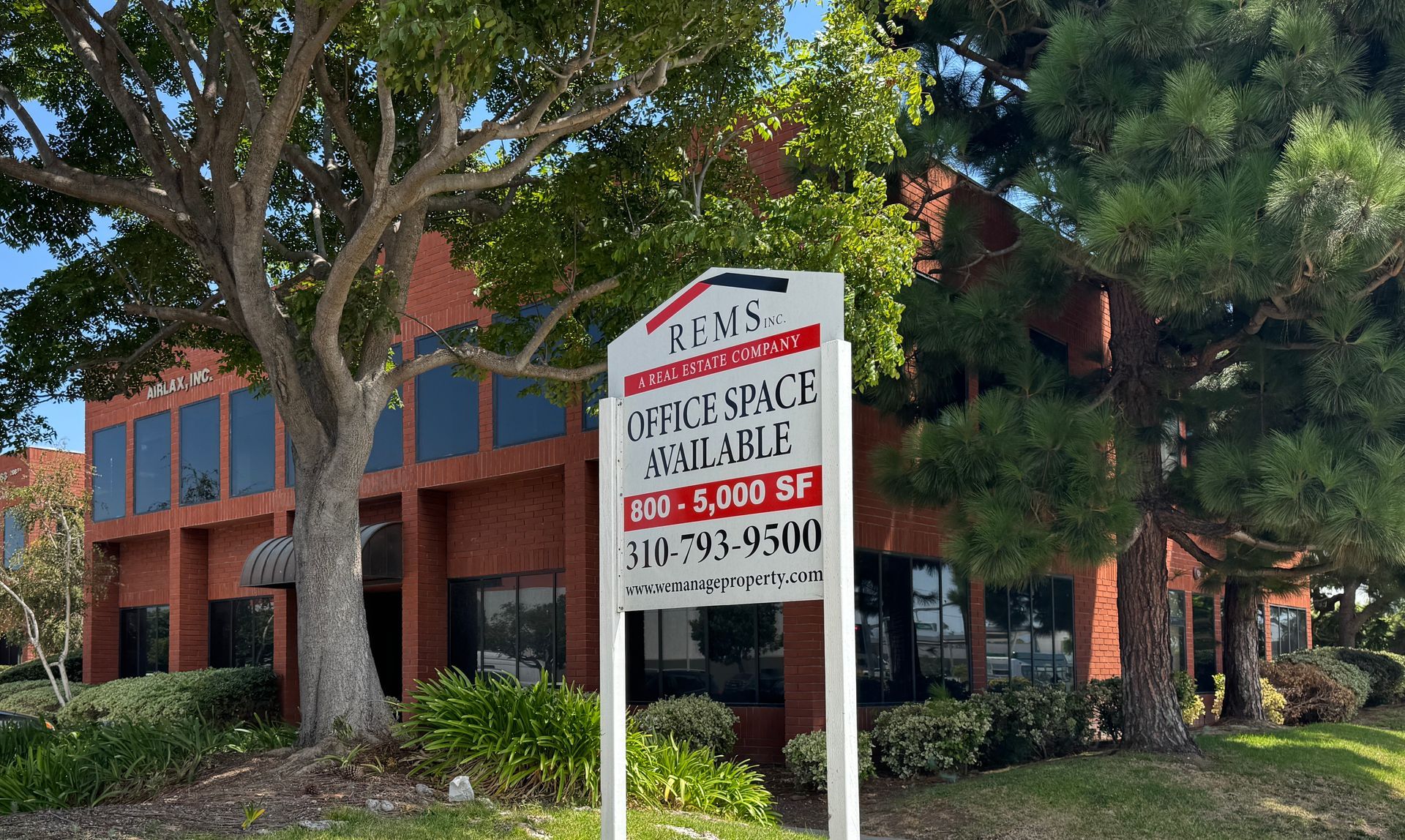 REMS property management office sign on Crenshaw Blvd in Torrance