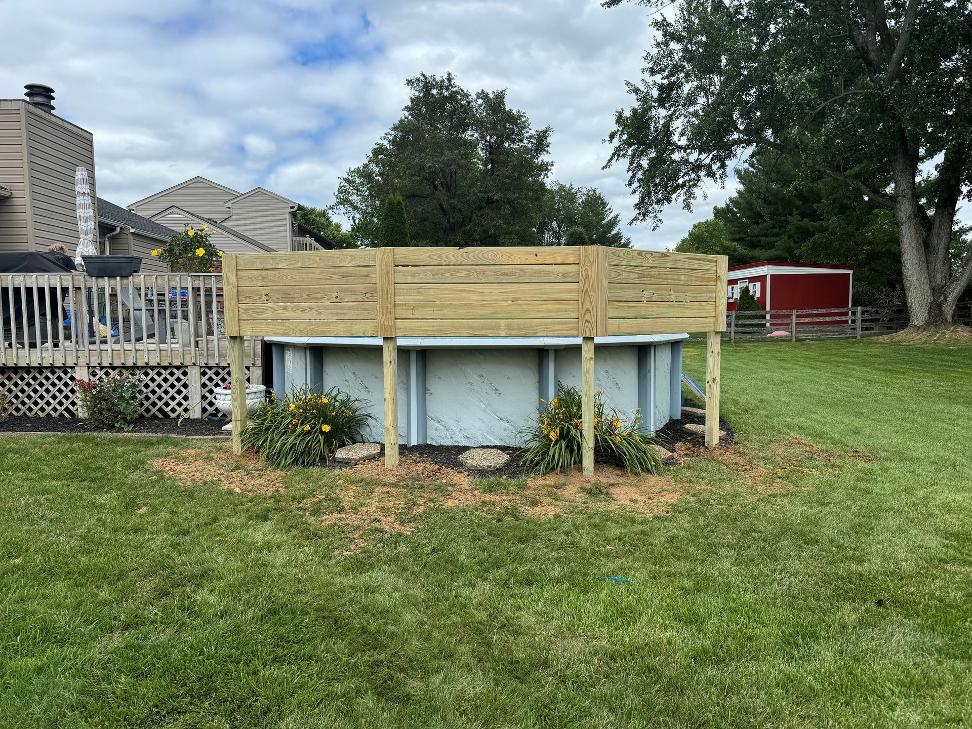 Swimming Pool Surrounded by a Wooden Fence — Louisville, KY — Shatkoff Fencing