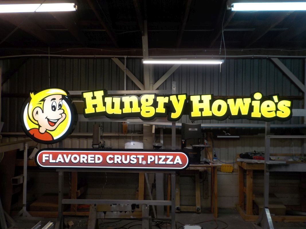 Lighted channel letters on raceway sign