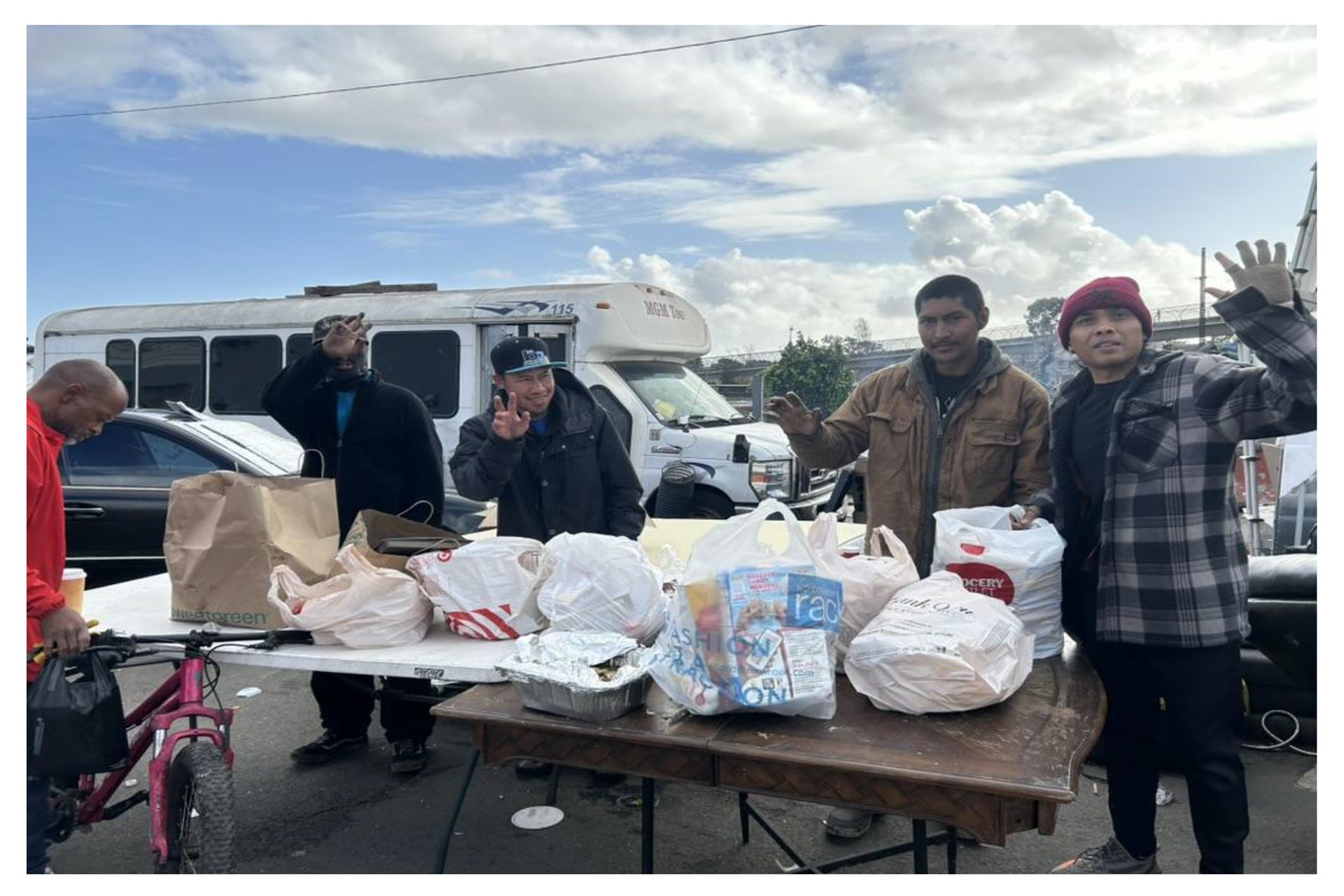 Arie giving away food and kitchen supplies to the unhoused