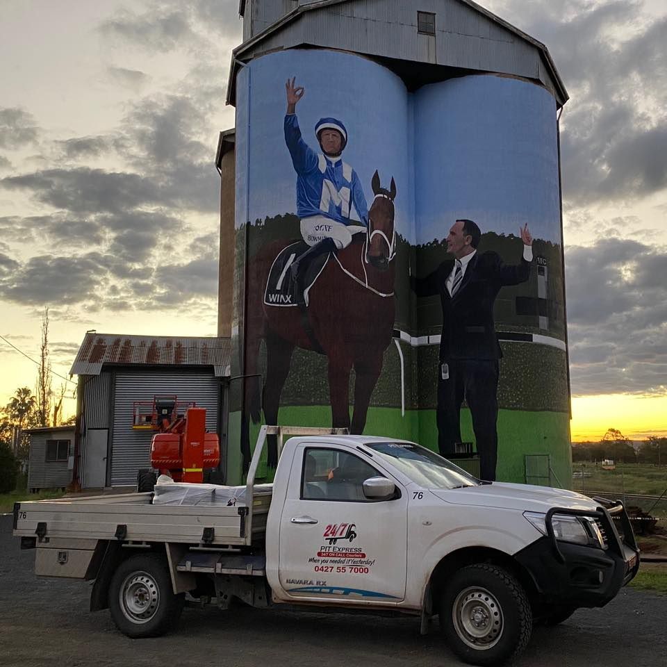 Truck is Parked in Front of a Large Mural of a Jockey on a Horse — Pit Express in Perth, WA