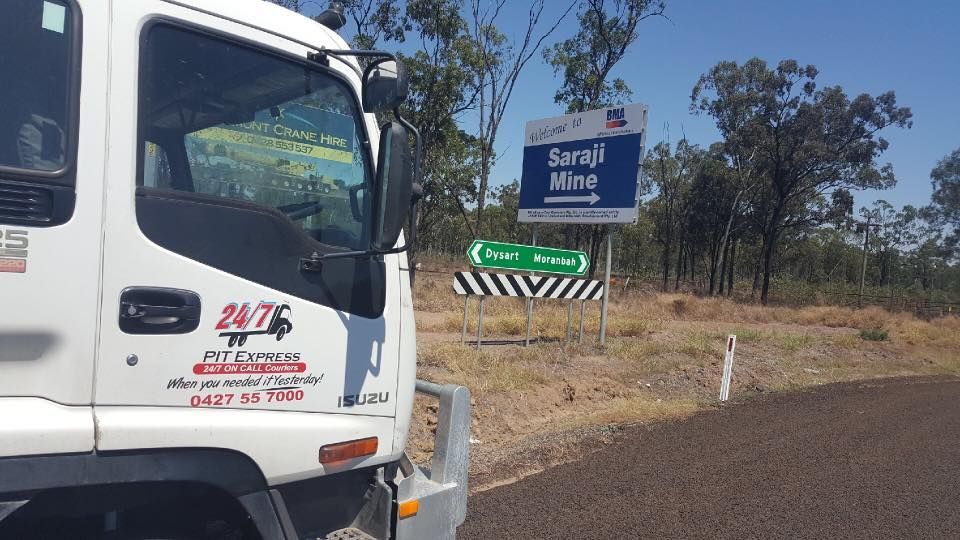 White Truck is Parked on the Side of the Road Next to a Sign — Pit Express in Rutherford, NSW