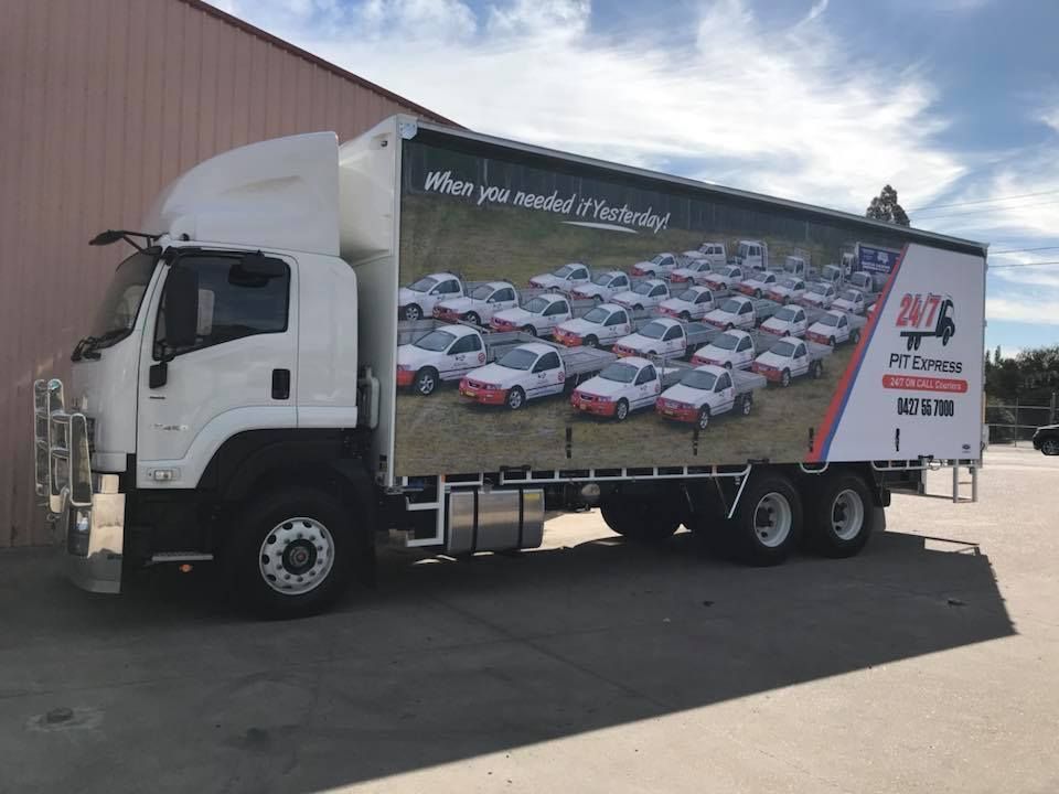 Large White Truck is Parked in Front of a Building — Pit Express in Gold Coast, QLD