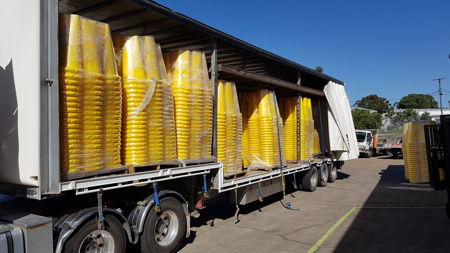 Truck Filled With Lots of Yellow Buckets is Parked in a Parking Lot — Pit Express in Perth, WA