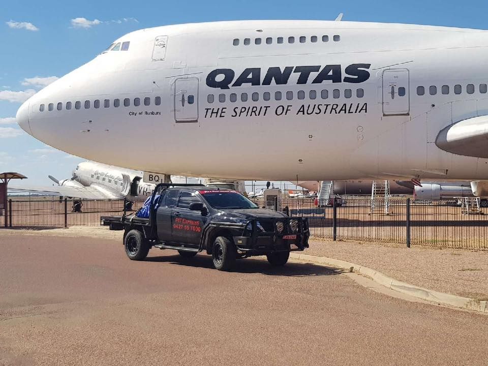 Truck is Parked in Front of a Qantas Plane — Pit Express in Wetherill Park, NSW