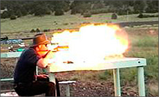 A man firing a gun