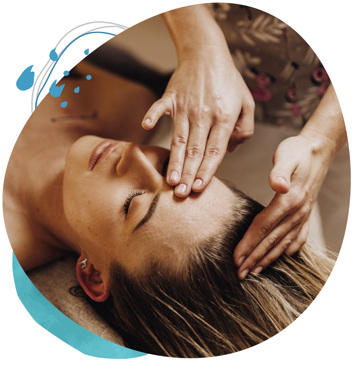 A woman is getting a head massage at a spa.