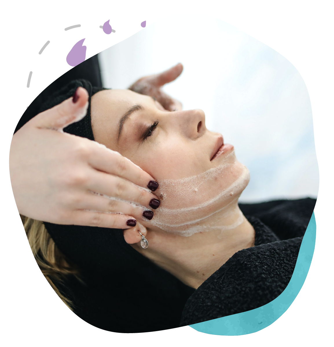 A woman is getting a facial treatment at a spa.