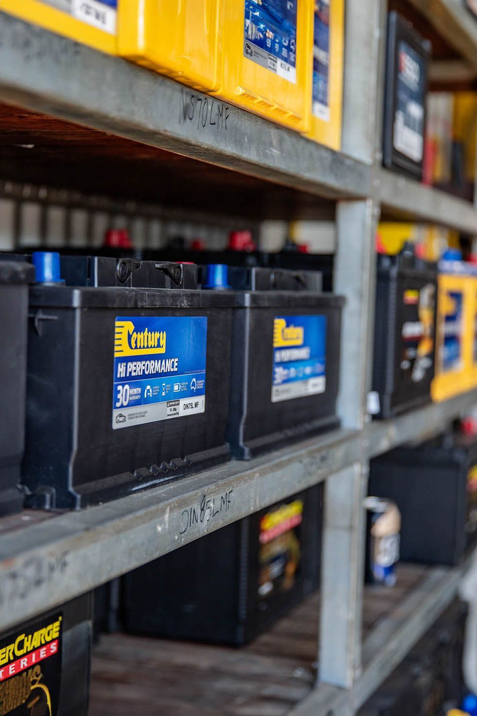 Car battery's in Millmerran Queensland, A bunch of batteries are lined up on shelves in a store