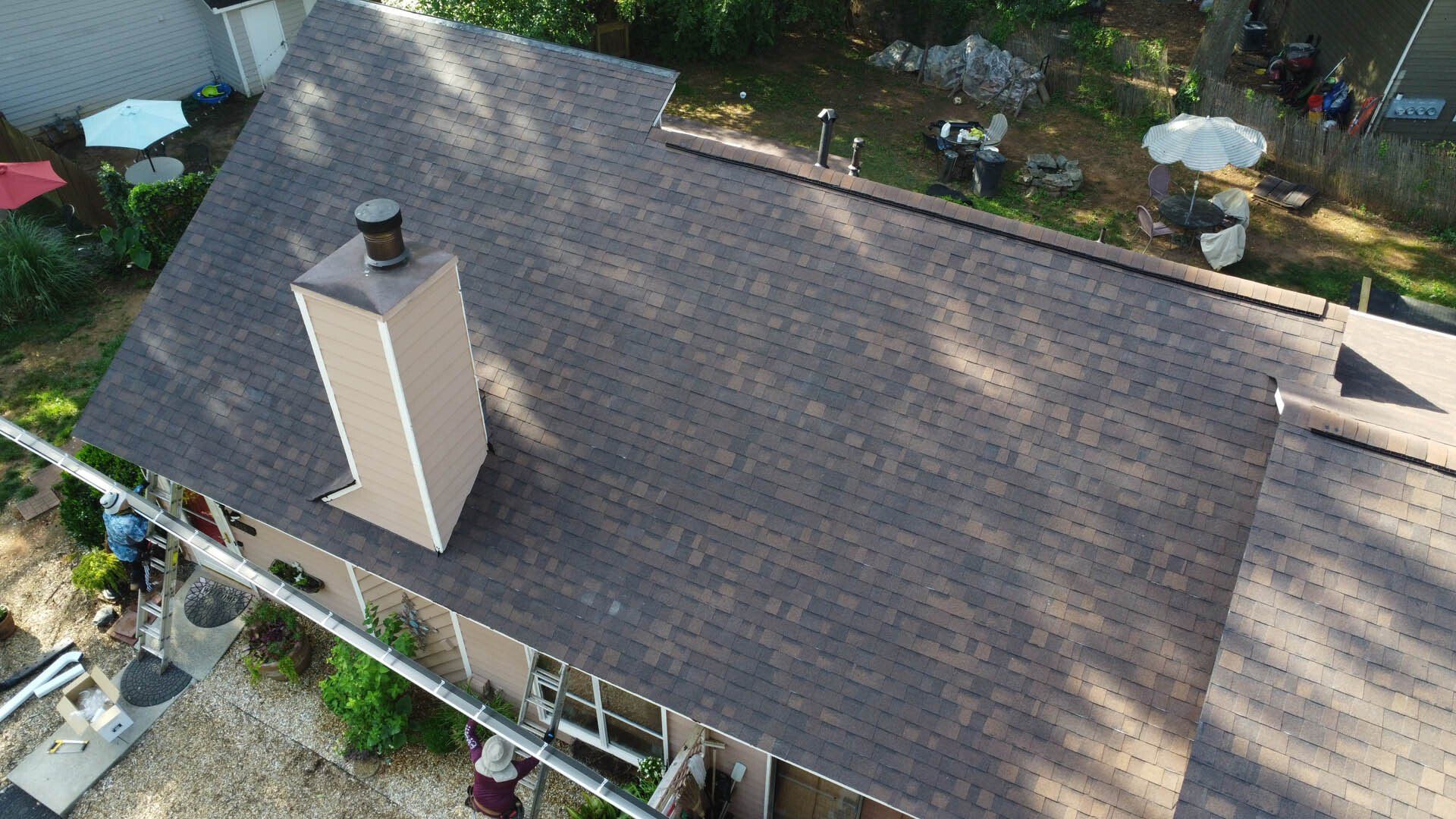 An aerial view of a house with a chimney on the roof.