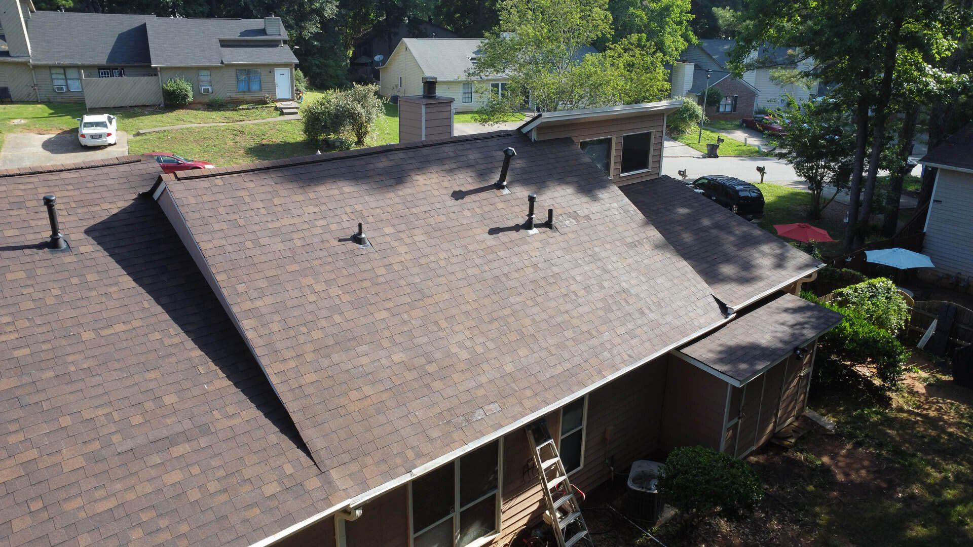 An aerial view of a house with a new roof