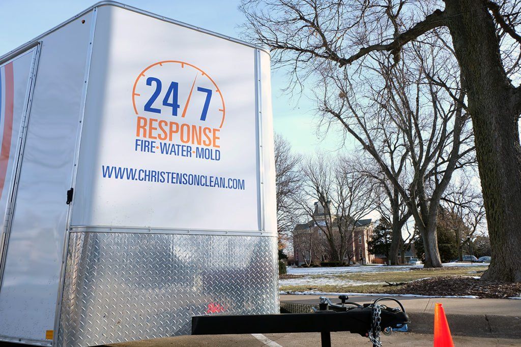 A 24/7 response trailer is parked on the side of the road
