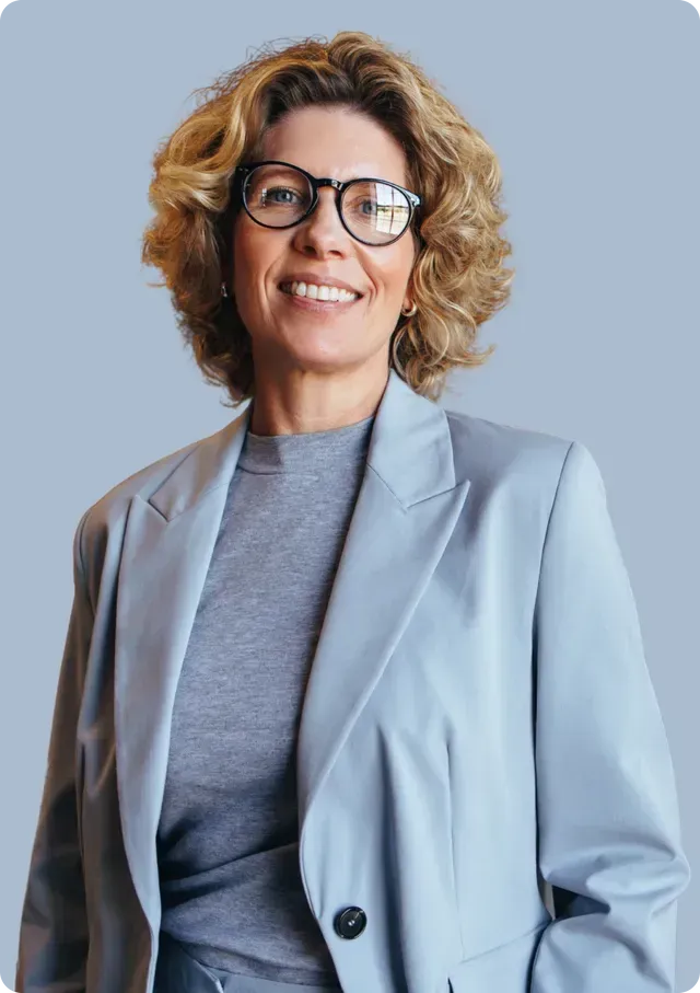 Woman in Glasses standing and smiling