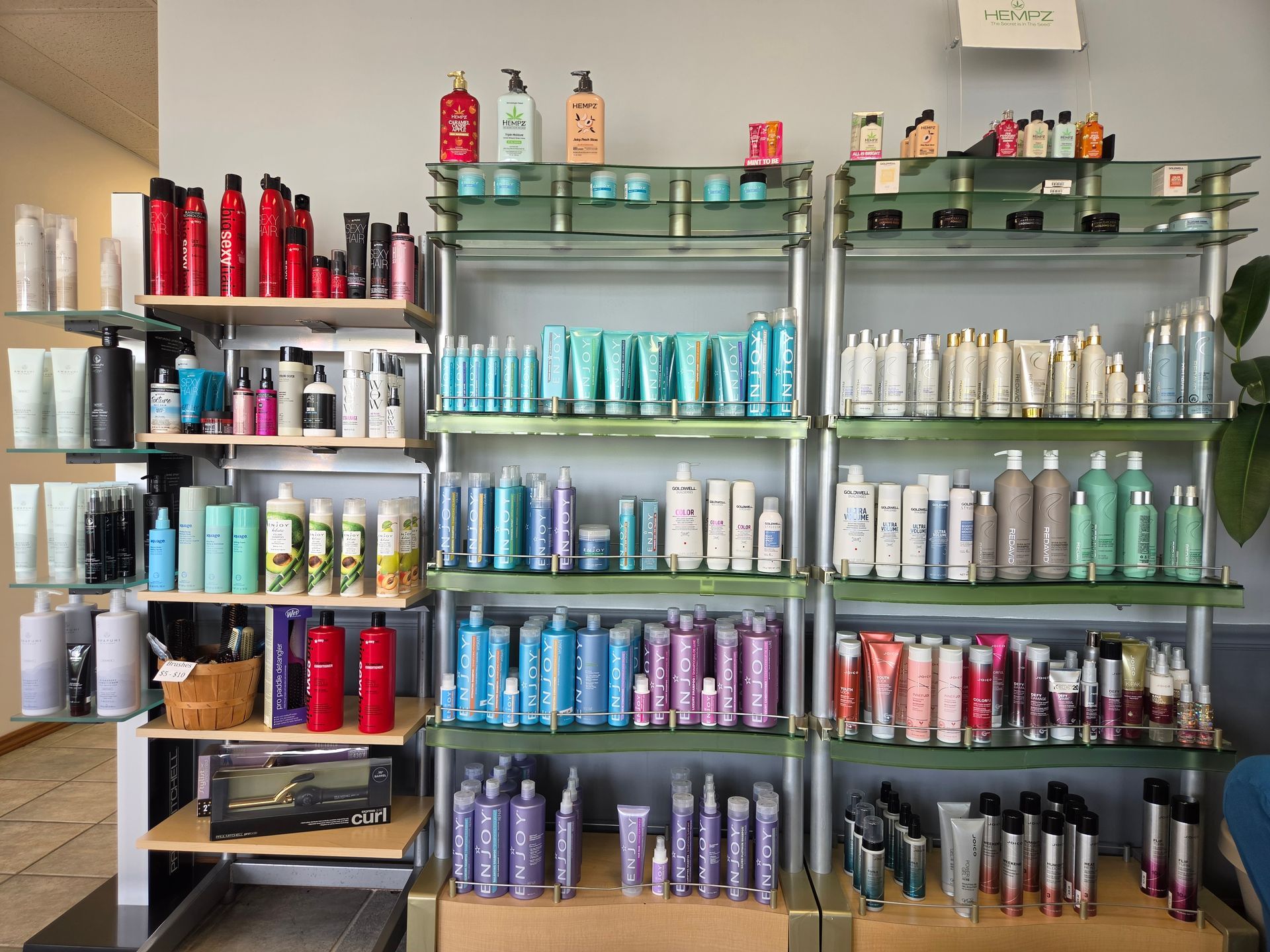 Shelves stocked with colorful hair-care products in a salon or beauty supply store