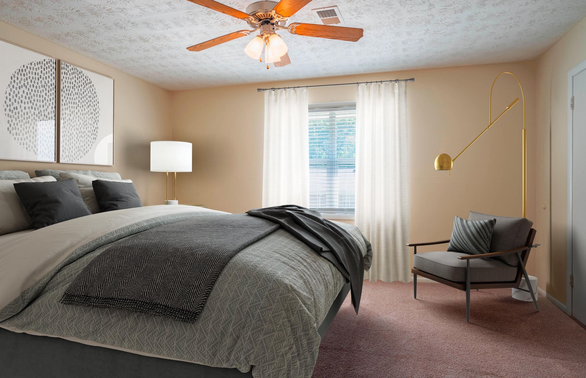 Cozy bedroom with a gray bed, lamp, chair, window curtains, and a ceiling fan with orange blades