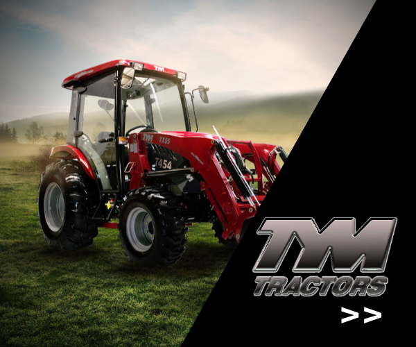 Red tractor in a field with the TM Tractors logo on the right