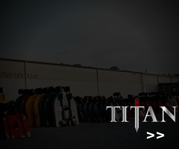 Dark warehouse with rows of gear and the word “TITAN” in the lower right.