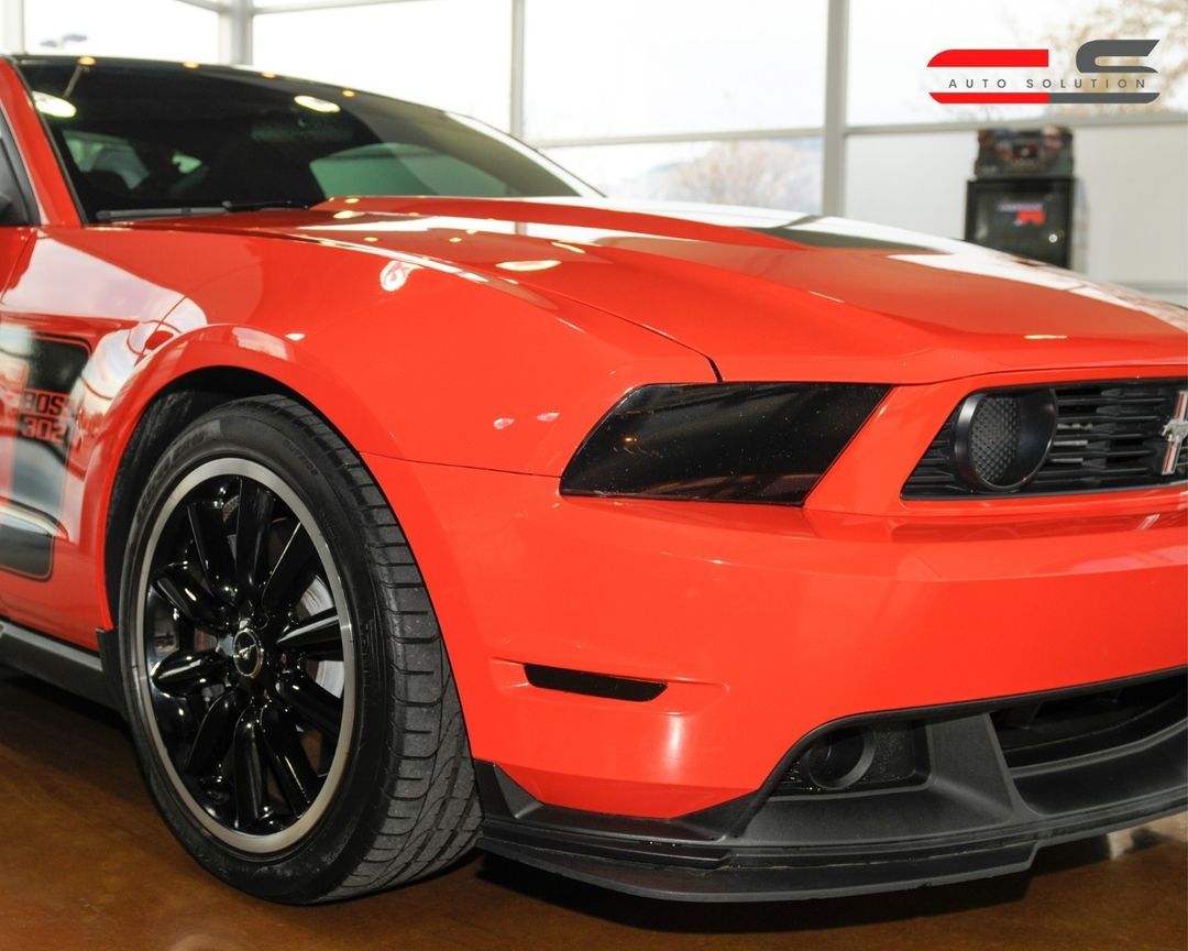 Bright Red Mustang Displayed Indoors with Glossy Finish | Auto Repair & Used Car Sales