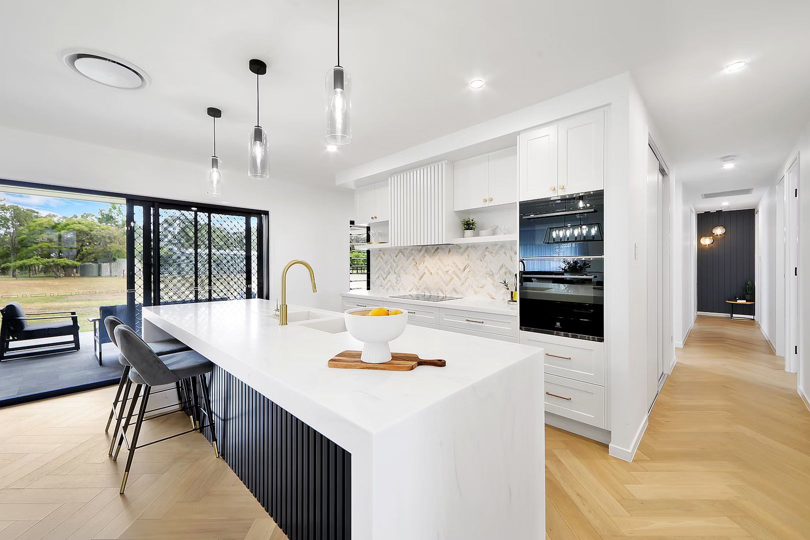 A Bathroom With Two Sinks And A Large Mirror — Master Cabinets Bundaberg in Kensington, QLD