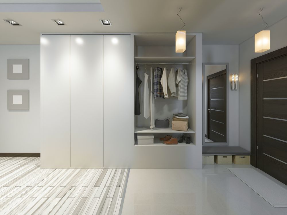 A Walk In Closet With Wooden Shelves And Drawers — Master Cabinets Bundaberg in Woodgate, QLD
