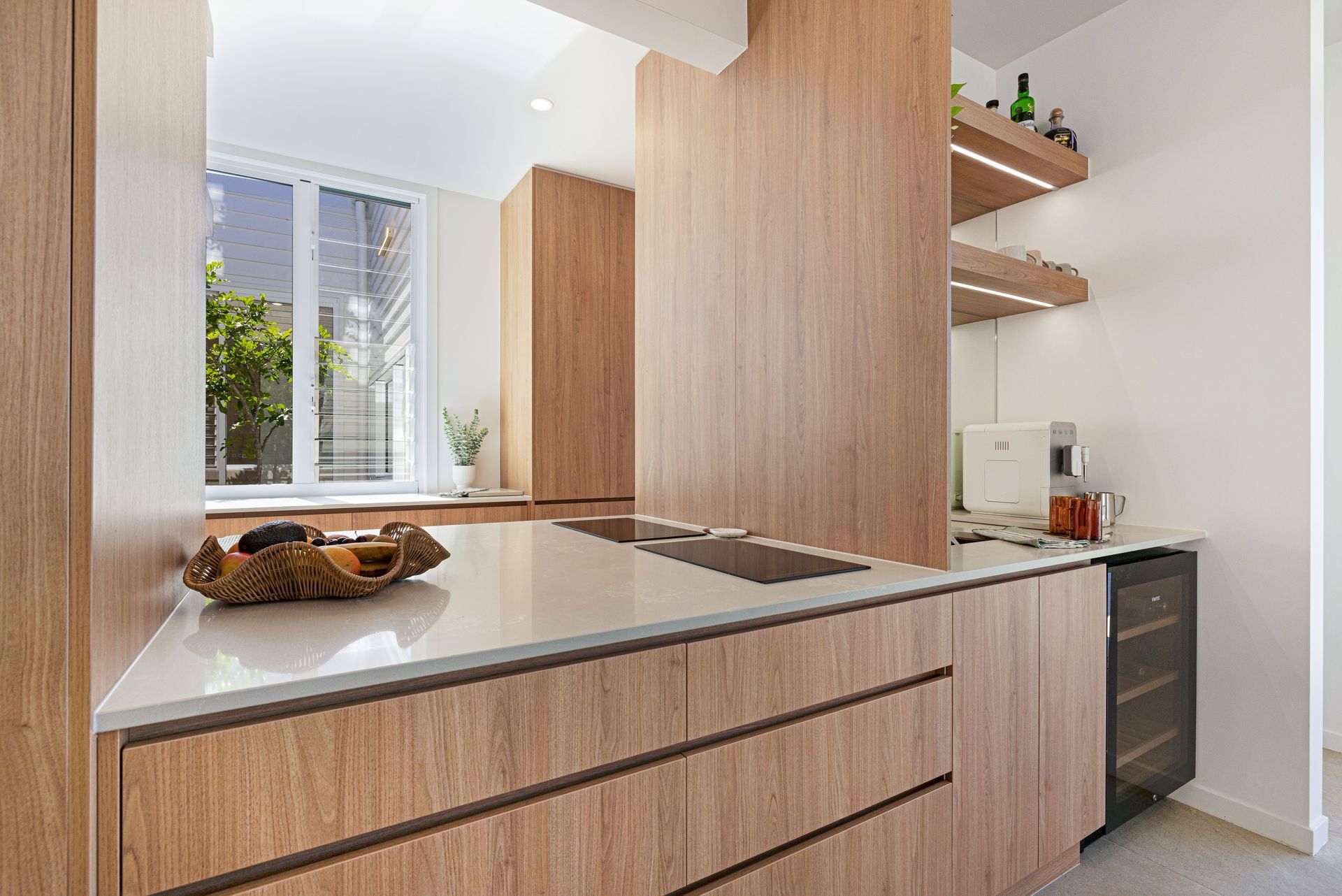 Office Space With Black Desks, Bookshelves, And Potted Plants — Master Cabinets Bundaberg in Kensington, QLD