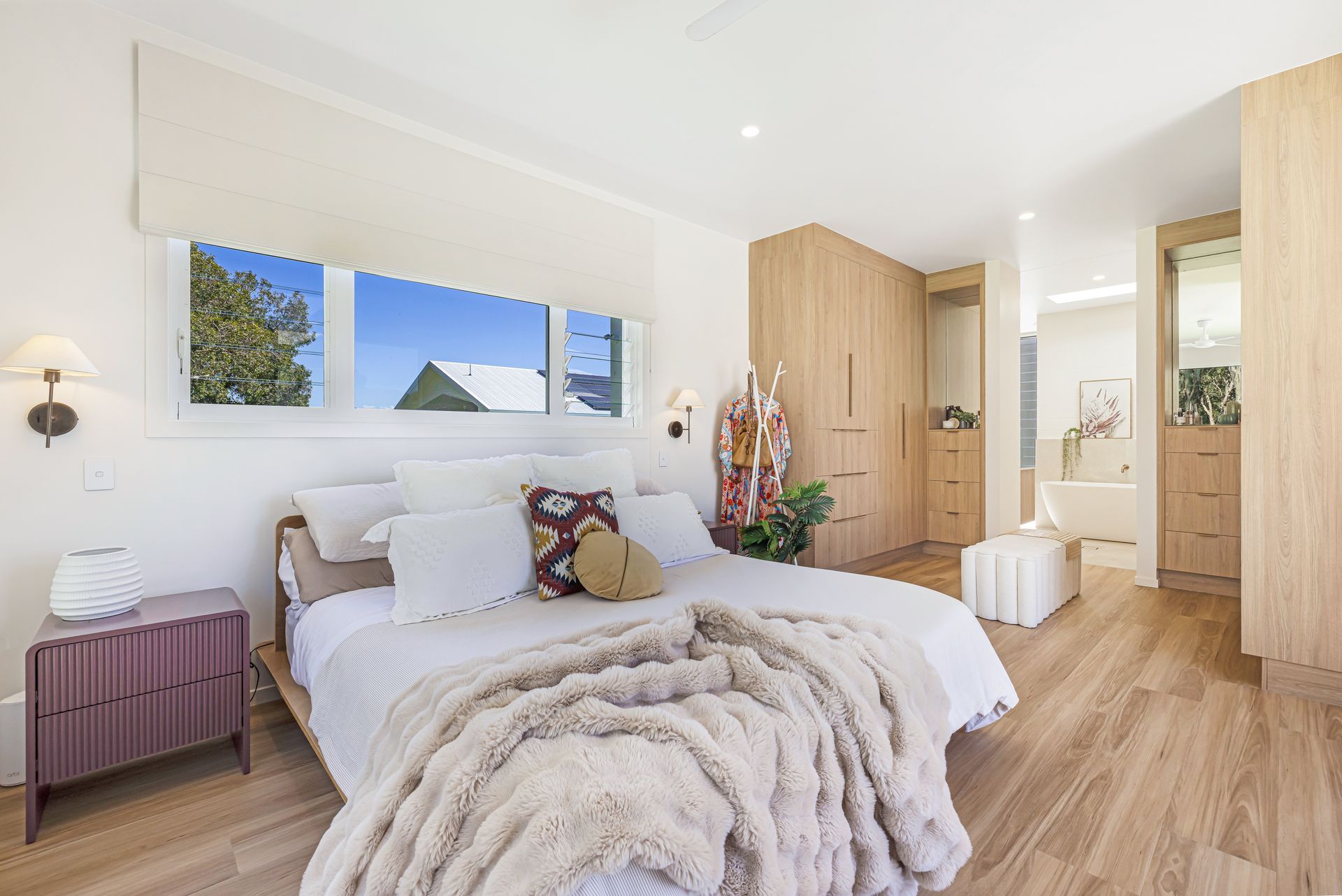 A Kitchen With White Cabinets And Shelves And A Green Tile Wall — Master Cabinets Bundaberg in Kensington, QLD