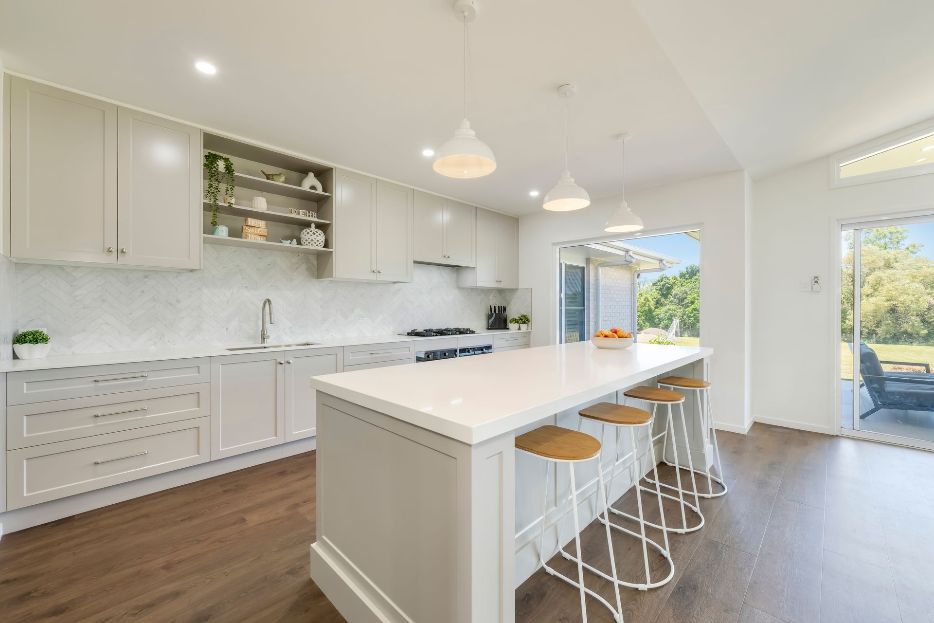 Bright Modern Kitchen With White Cabinets, Marble Island — Master Cabinets Bundaberg in Kensington, QLD
