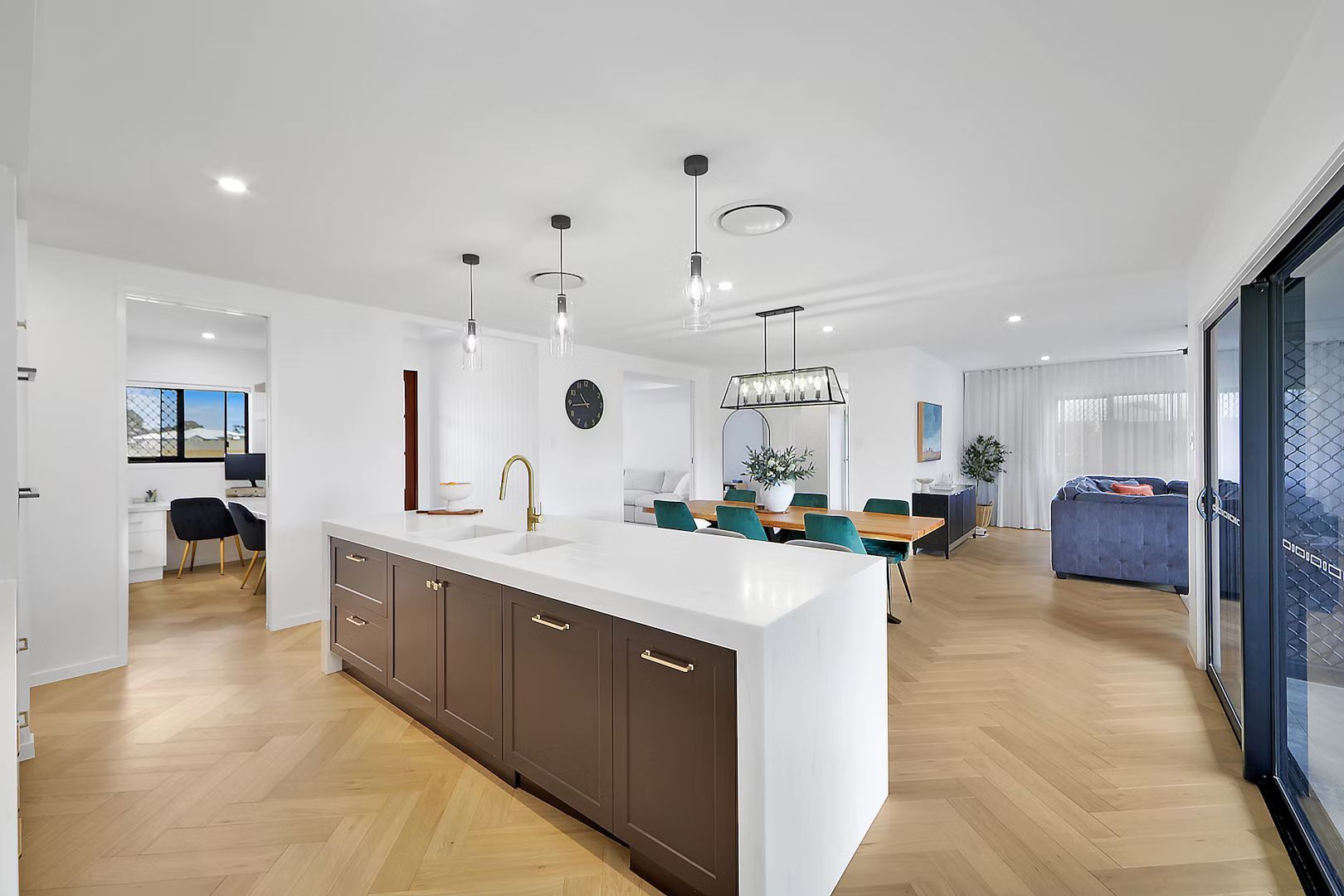 Modern Kitchen With Wood Accents, Light Cabinetry, Island, Pendant Lights — Master Cabinets Bundaberg in Burnett Heads, QLD
