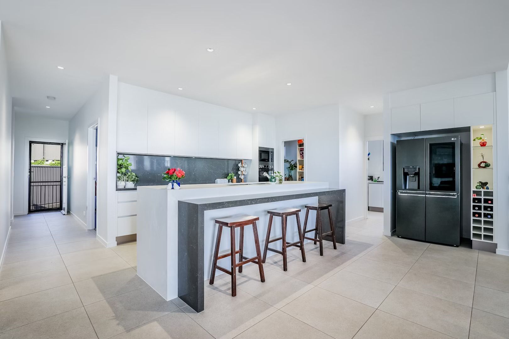 Modern Kitchen With Wood and White Cabinetry — Master Cabinets Bundaberg in Kensington, QLD