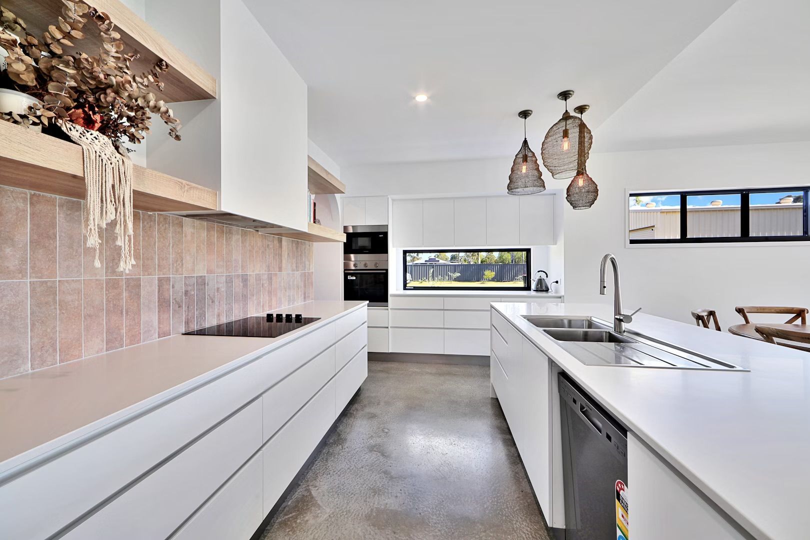 Modern Kitchen With Wooden Cabinets and White Countertops — Master Cabinets Bundaberg in Kensington, QLD