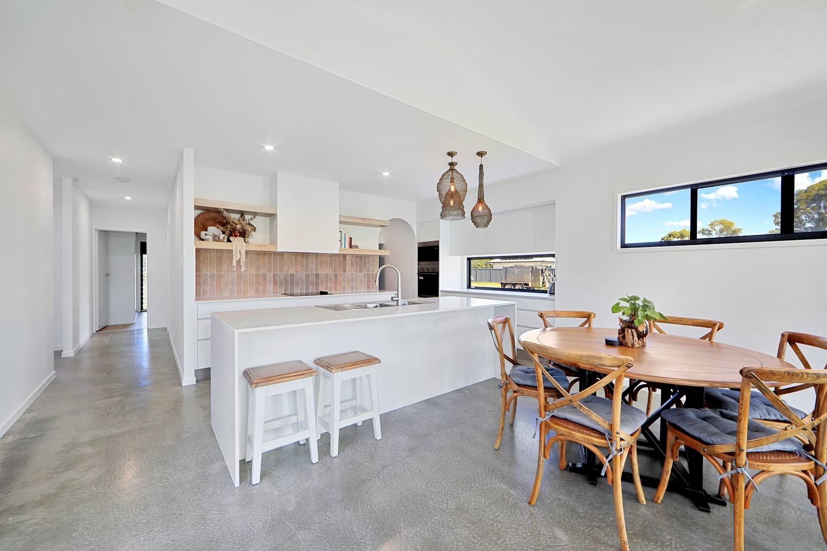 White Modern Kitchen With Island — Master Cabinets Bundaberg in Kensington, QLD