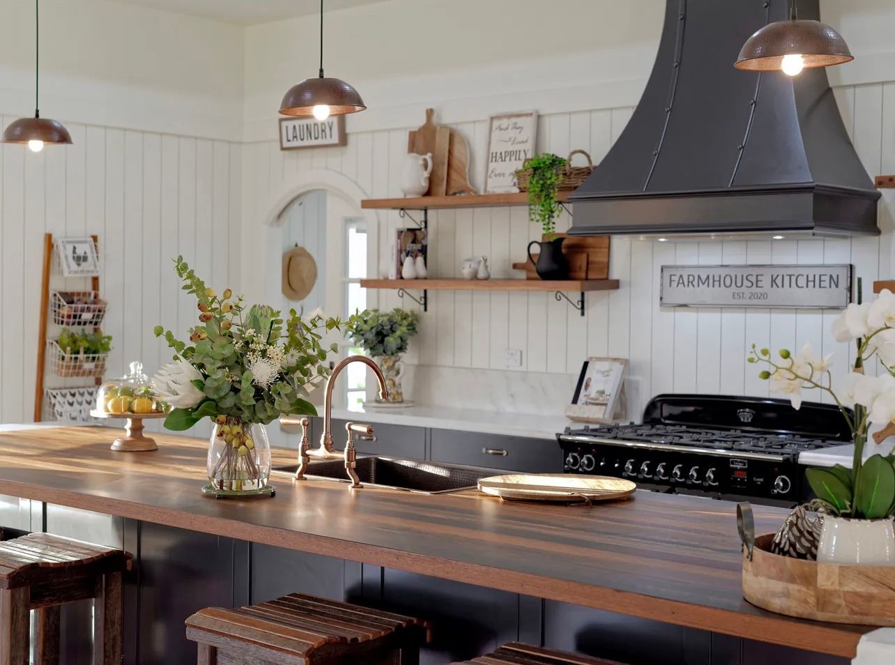 White Kitchen With Cabinets, Island, and Stainless Steel Appliances — Master Cabinets Bundaberg in Kensington, QLD