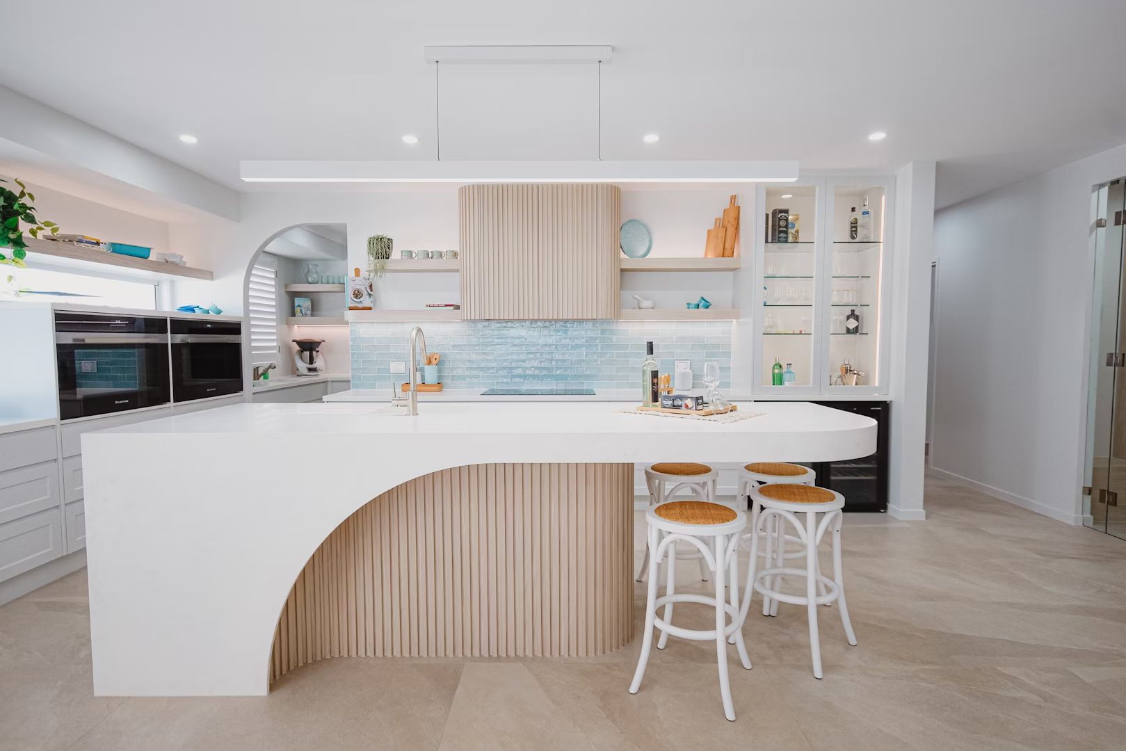 Modern, Bright Kitchen With Wood Cabinets, White Countertops — Master Cabinets Bundaberg in Kensington, QLD
