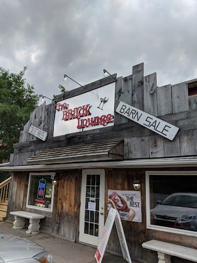 A building with a sign that says barn sale on it.