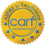 CARF Accredited gold seal with blue text and stars, reading “Aspire to Excellence”