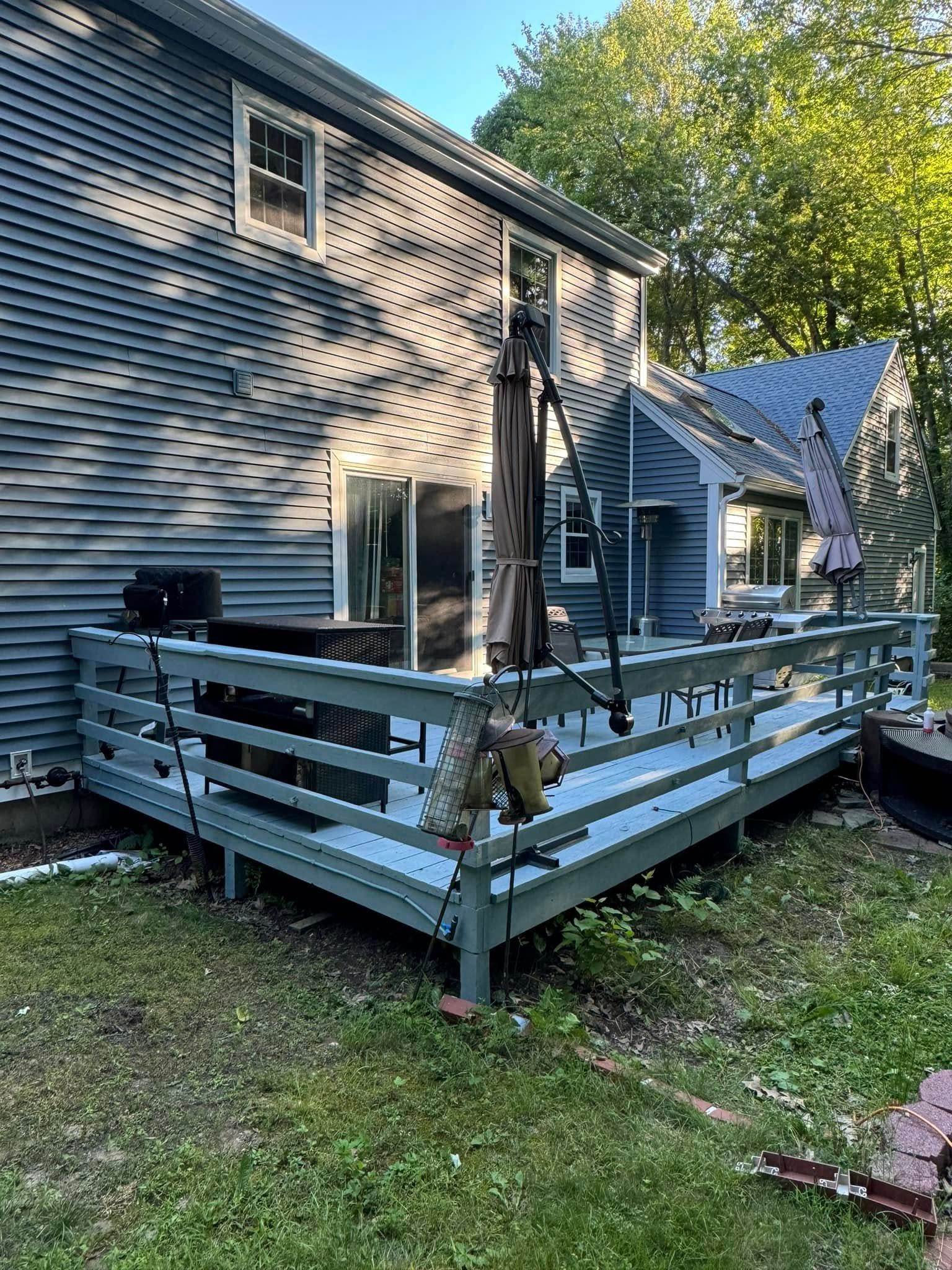 Finished backyard deck installation in Farmington CT by J & G Cleaning