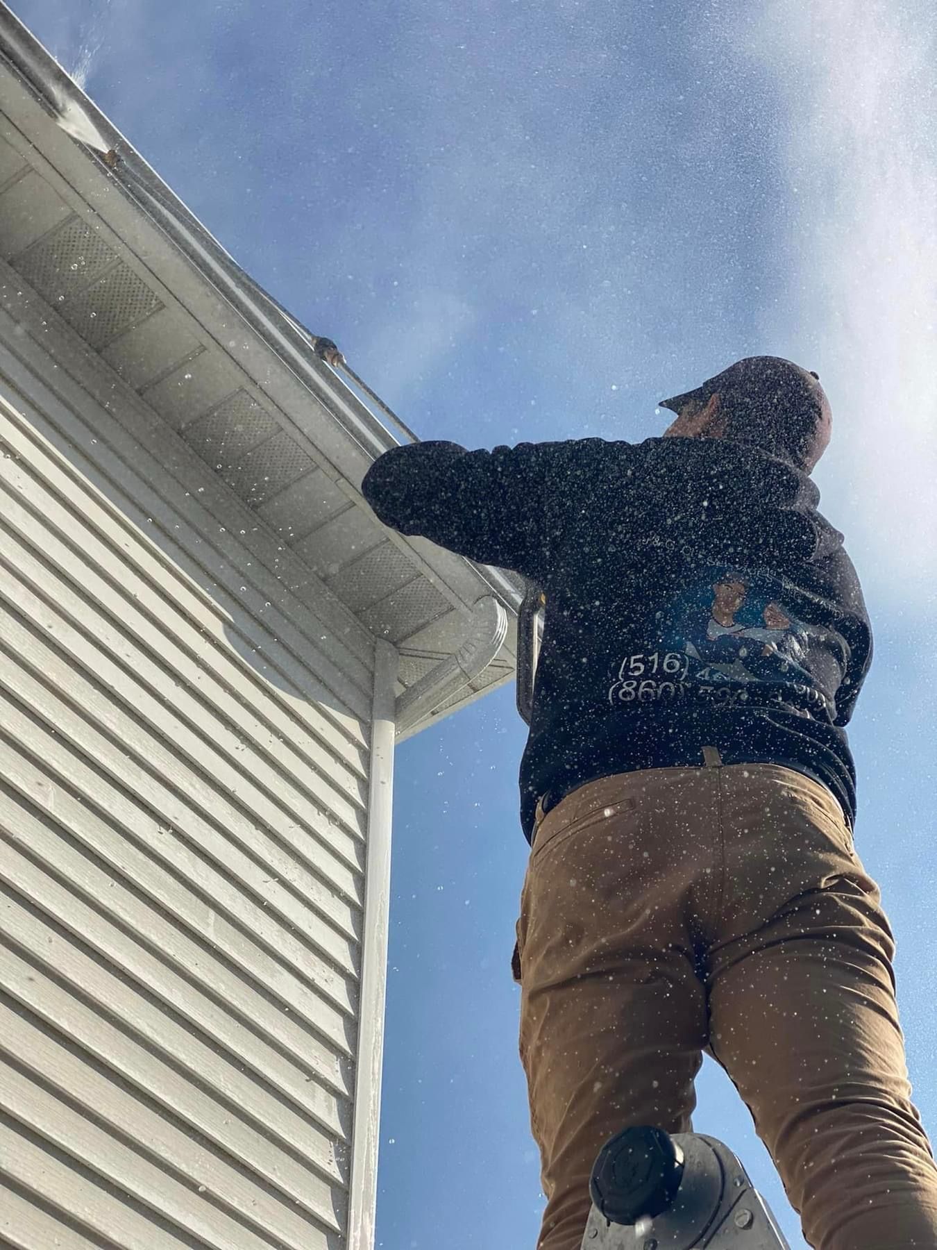 Driveway power washing in Bristol CT removing dirt and stains
