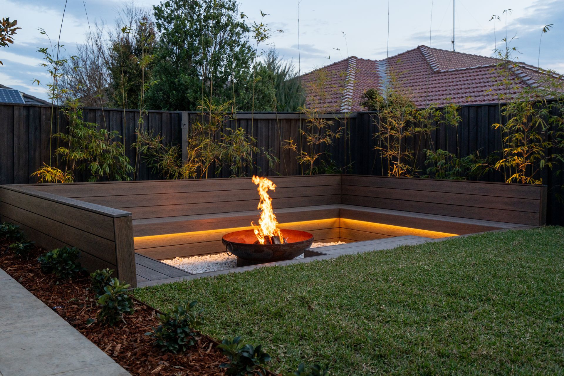 There is a fire pit in the middle of the yard.