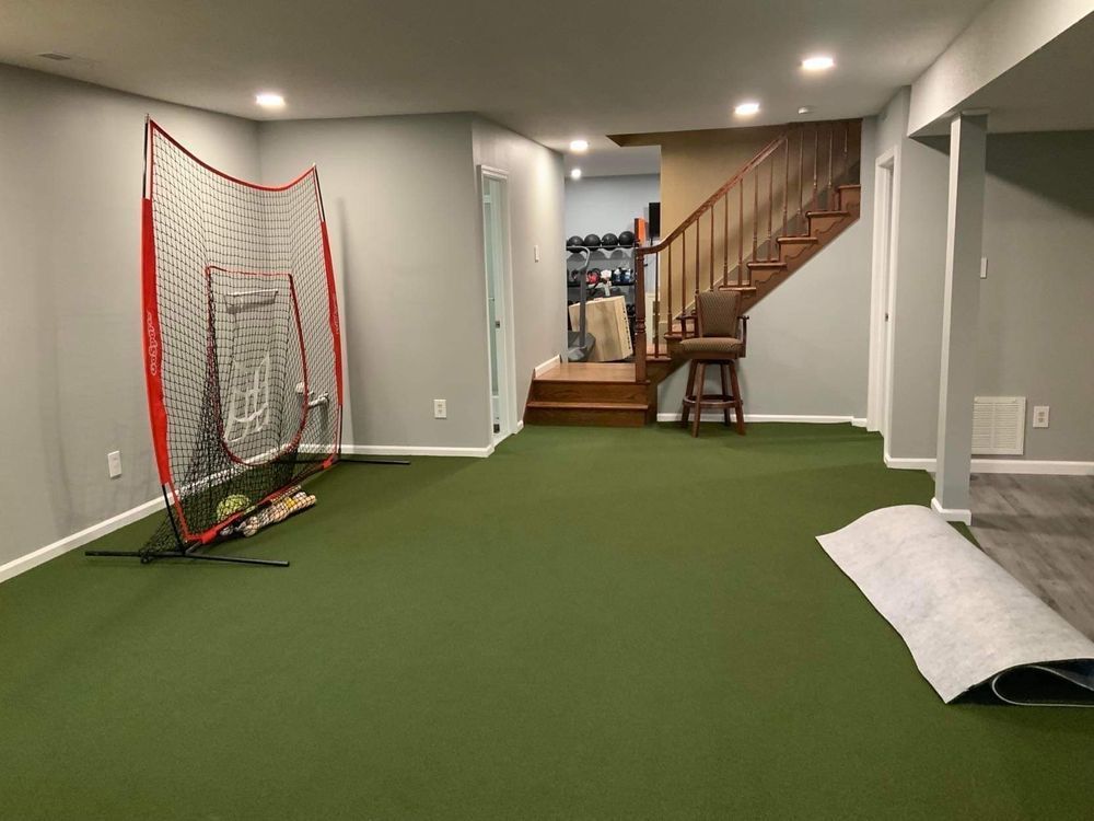There is a lacrosse net in the middle of the room.