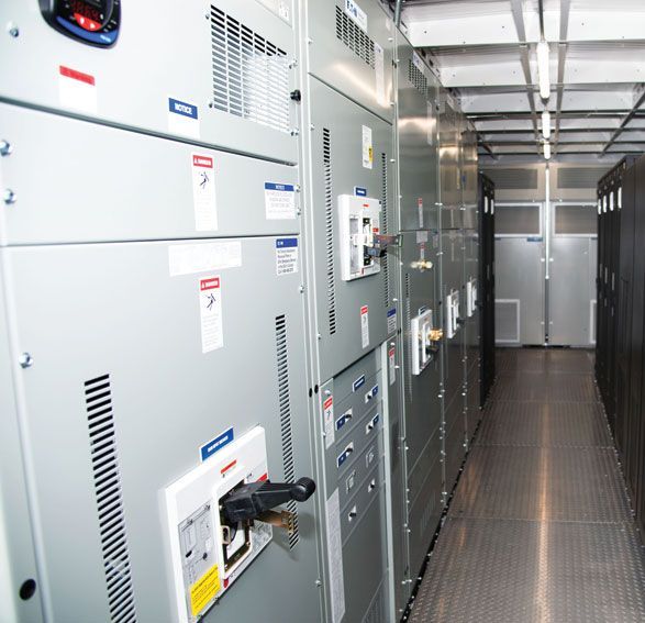 Trailer-mounted UPS unit staged on a commercial facility site