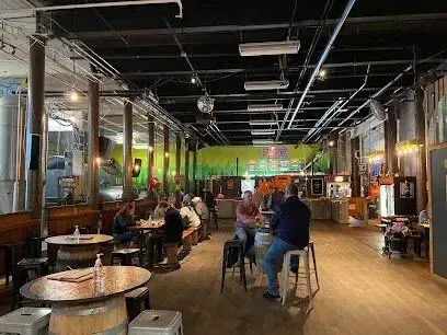 Chimney-Sweep-Portland-A group of people are sitting at tables in a large room.